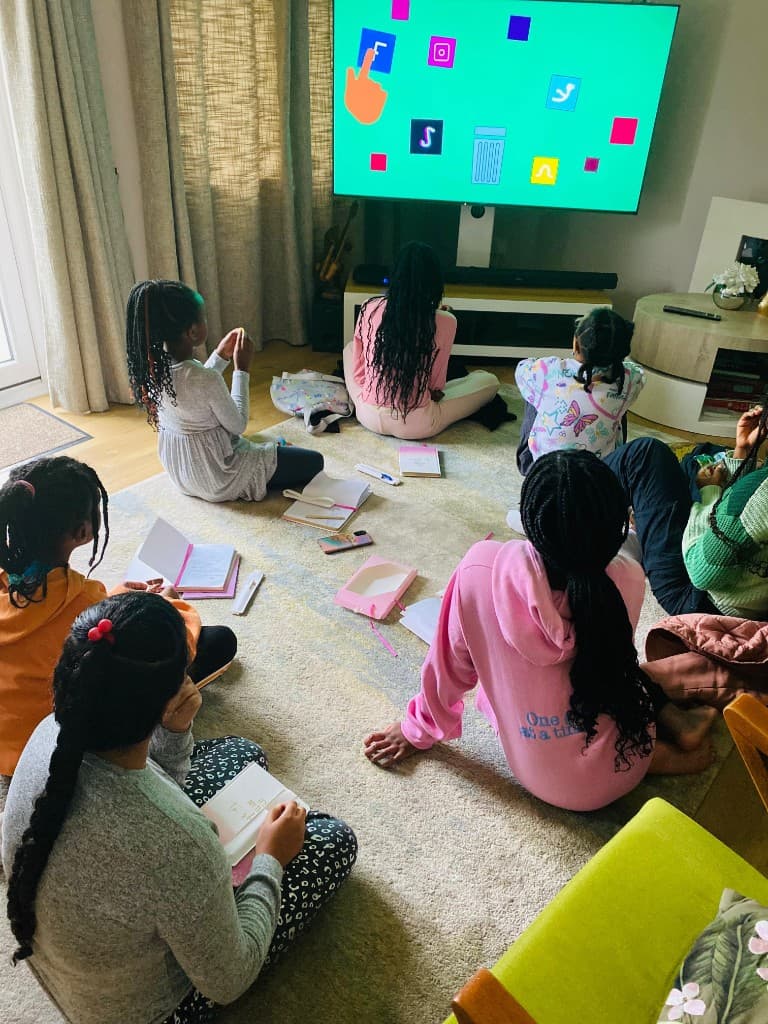 Girls and young women taking part in a group workshop session